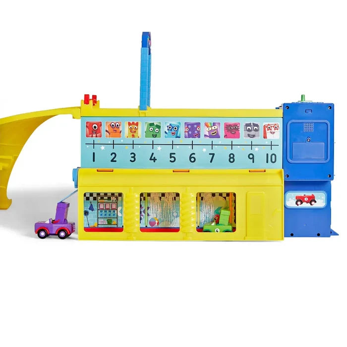 Yellow and blue toy garage featuring Numberblocks characters 1-10, play rooms, a lift tower, and a purple car.
