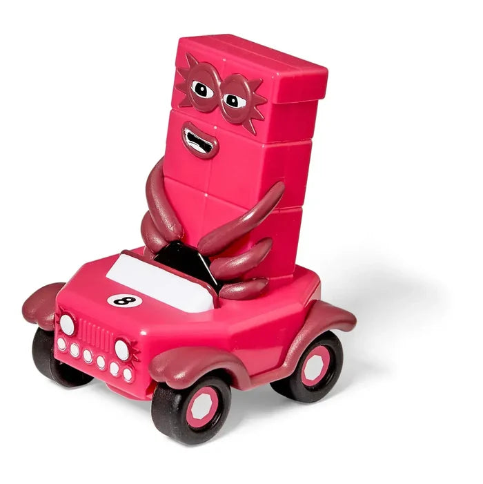 Pink eight-block character with eight legs sitting in a pink toy car with black wheels and white headlights.