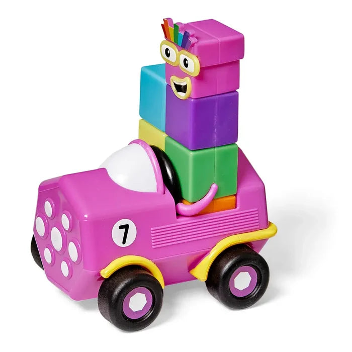 Purple toy car with white dots and number 7, carrying a colorful Numberblock Seven figure made of stacked cubes.