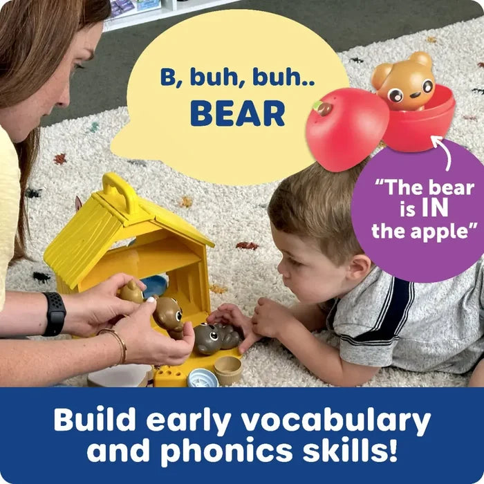 Woman and child play with bear figurines and a yellow house. Text bubbles show phonics and vocabulary learning.
