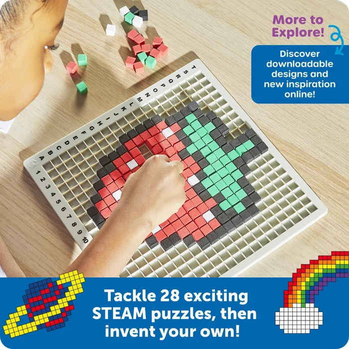 A child builds a pixelated strawberry with red and green cubes on a white grid tray with letter and number markers.