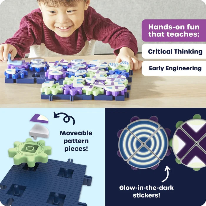 Child playing with green and purple interlocking gears featuring movable glow-in-the-dark pattern pieces on a blue base.