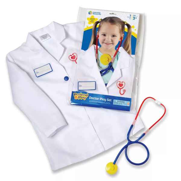 White child's doctor lab coat with name tag and heart logo, plus a red, blue, and yellow toy stethoscope.