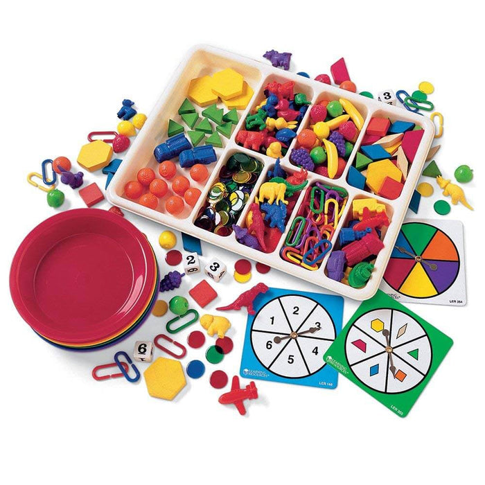 Sorting set with colorful plastic animals, shapes, fruit, links, number dice, spinners, and stacking bowls.