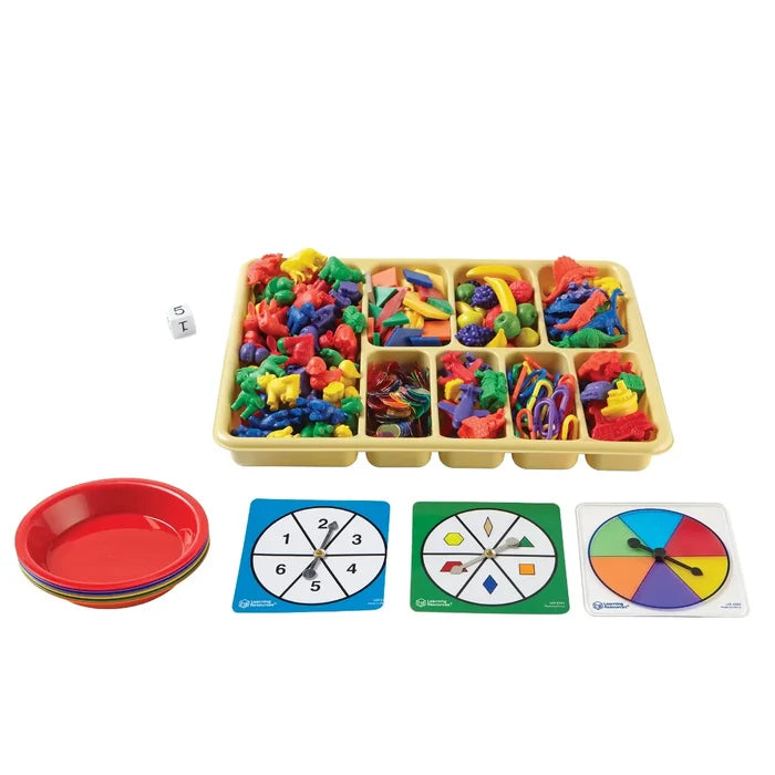Large sorting tray of colorful plastic counters, plus a dice, sorting bowls, and three game spinners.