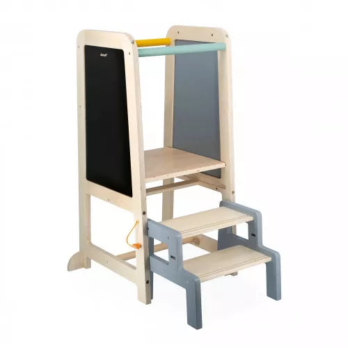 Light wood learning tower with chalkboard side, two gray steps, and colorful top safety bars.