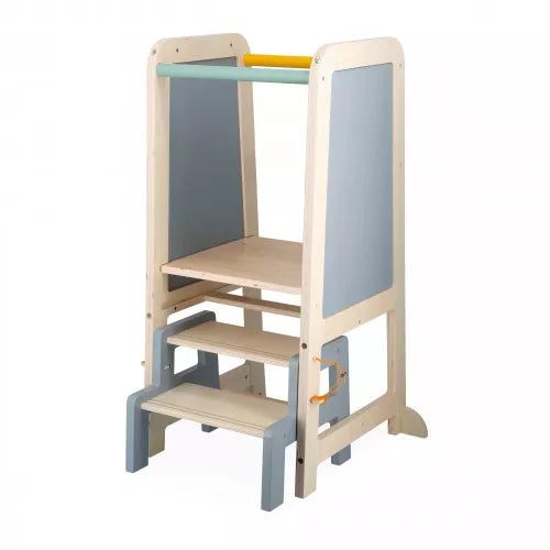 Wooden learning tower for toddlers with two steps, light blue side panels, and mint and yellow safety rails.