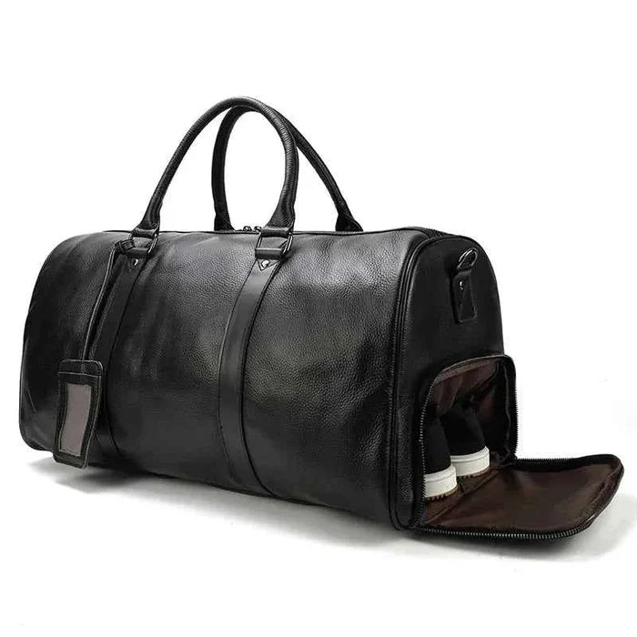 Leather business travel bag by Mead's Supply & Equipment Outfitters, black and bronze duffel with multiple compartments.