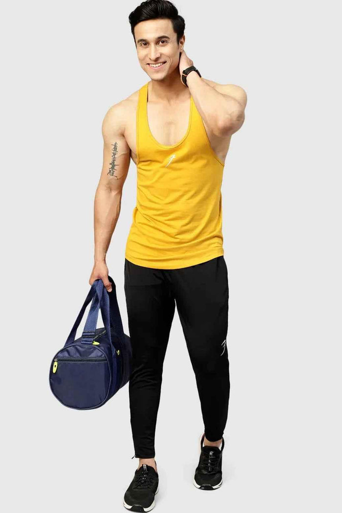 Mustard Fuaark Nz Legacy Stringer tank top hanging on a display mannequin.