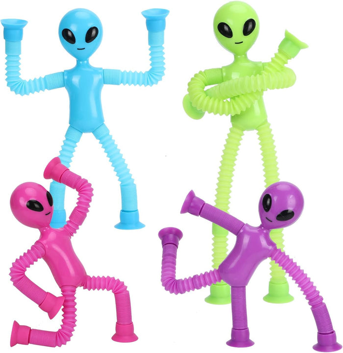 Four blue, green, pink, and purple alien toys with expandable pop tube limbs and suction cup hands and feet.