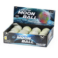Textured grey cratered toy balls in a blue space-themed display box with colorful glowing moon graphics.