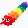 Rainbow-colored caterpillar toy with bumpy segments, large white eyes, and red antennae.