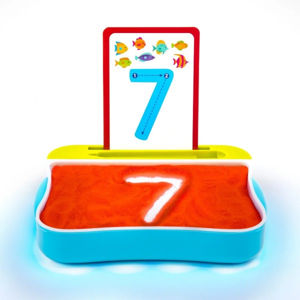 Blue light-up tray with orange sand showing a glowing number 7 and a matching instructional card with colorful fish.