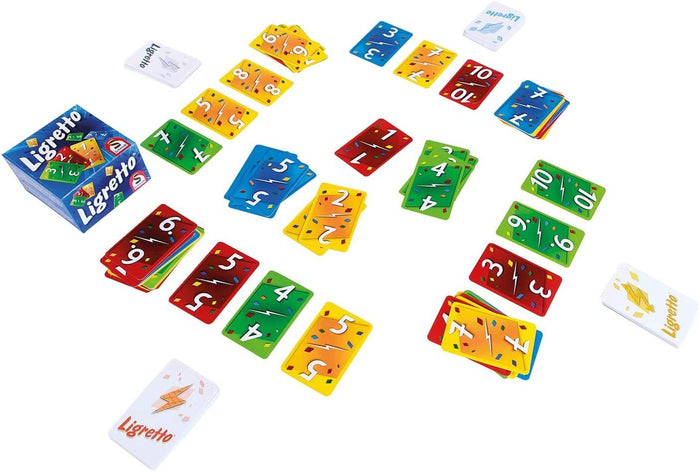 Ligretto game box and colorful numbered cards in red, yellow, green, and blue scattered on a white background.