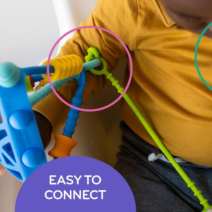 Close-up of a lime green silicone tether looped around a blue toy, highlighting the easy-to-connect design.