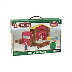 Green box showing a farm scene with a red log barn, yellow roof, farmer figure, goat, and chicken figures.