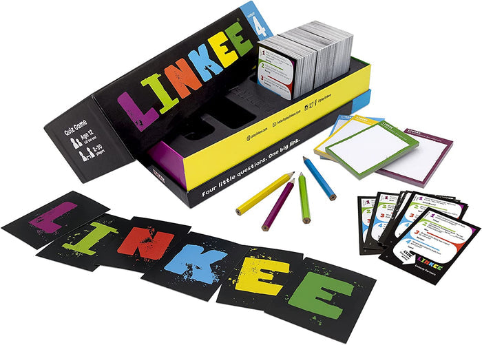 Black and yellow trivia game box with colorful pencils, notepads, and letter cards spread on a white surface.