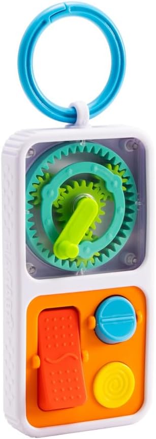 White toy with blue ring, visible green gears, red switch, blue dial, and yellow button on an orange panel.