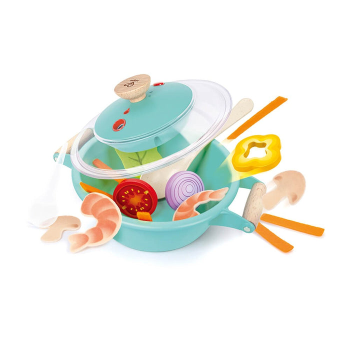 Teal toy pot with wooden handles and clear lid, featuring play food like shrimp and vegetable slices floating mid-air.