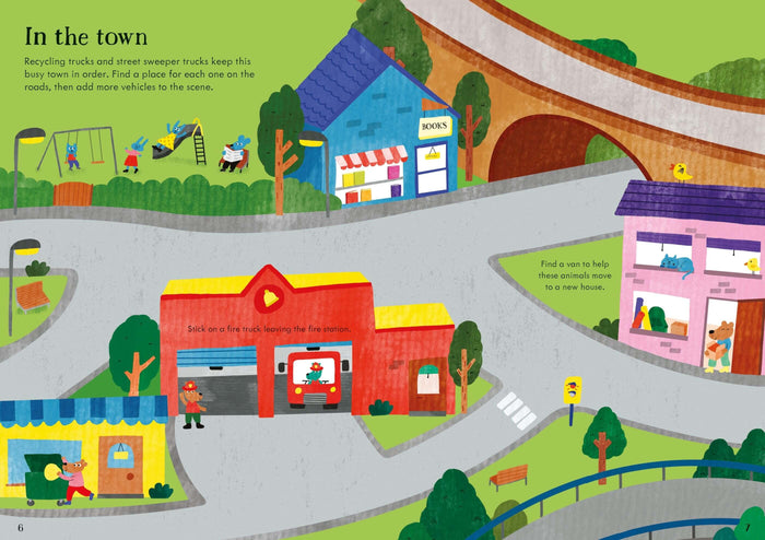 Colorful town scene illustration with a red fire station and roads for placing truck and vehicle stickers.