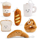 Six assorted plush food clips: croissant, toast, pretzel, baguette, coffee cup, and mug with cute embroidered faces.