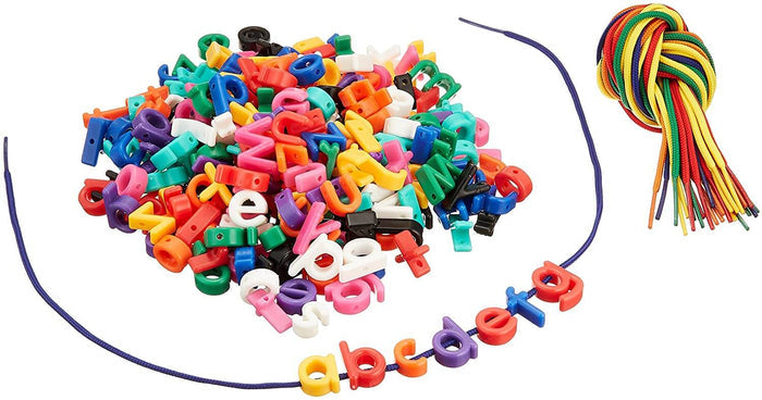 A pile of colorful lowercase letter beads, a blue lace spelling abcdefg, and a bundle of extra laces.