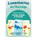 Sea life flashcards featuring a sandpiper, shark, and crab with text in Irish, English, and French on a teal background.