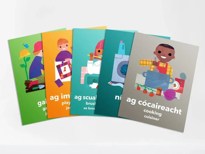 Five colorful, illustrated flashcards fanned out showing kids doing daily tasks, with text in Irish, English, and French.