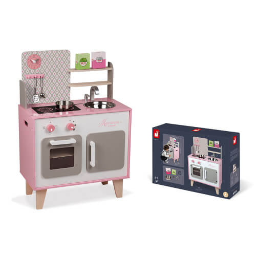 Pink and grey wooden play kitchen featuring a sink and stove, shown next to its product packaging.