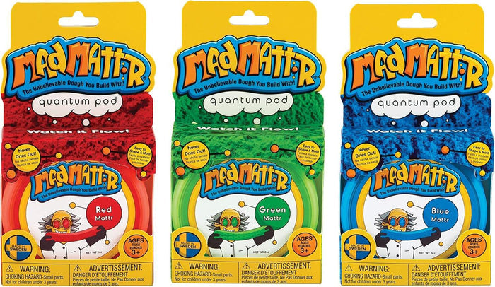 Three colorful Mad Mattr Quantum Pod packages in red, green, and blue featuring a cartoon character stretching dough.