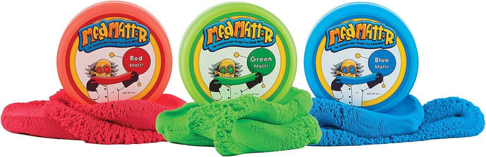 Red, green, and blue circular pods with piles of matching textured molding dough spilled in front of each lid.