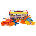 Plastic toolbox with piles of pink and blue moldable sand, orange plastic construction tools, and molded blue bricks.