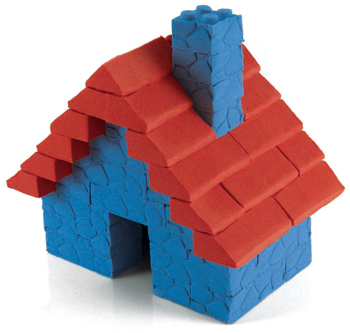 Blue stone-textured toy house with a red shingled roof and a blue chimney, made from colorful molding sand.