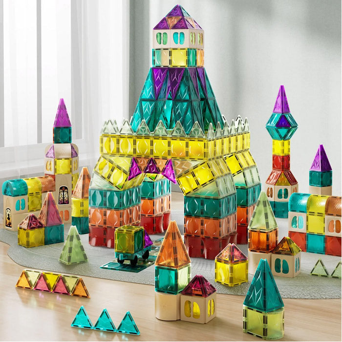 Colorful translucent magnetic tiles built into tall towers, houses, and a castle in various colors and geometric shapes.