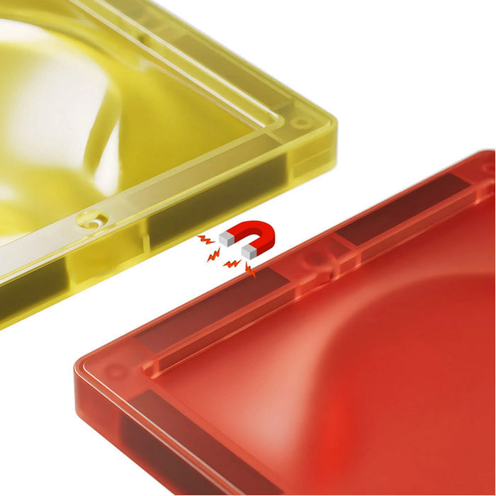Close-up of translucent yellow and red magnetic building tiles with an icon showing magnetic attraction.