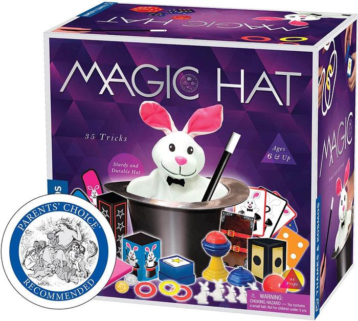 Purple magic kit box featuring a white plush rabbit in a silver hat, colorful props, cards, and a black wand.