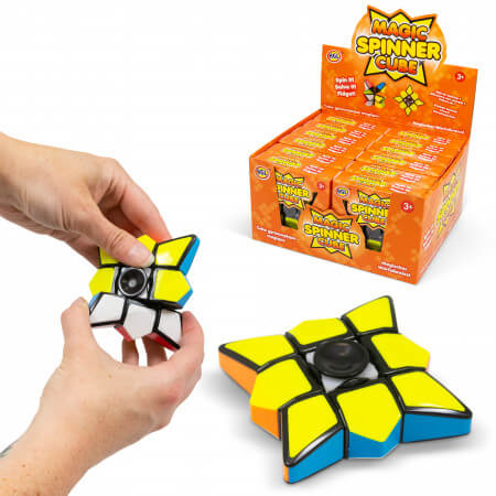 Hands twisting a star-shaped puzzle spinner with yellow and blue panels next to an orange retail display box.