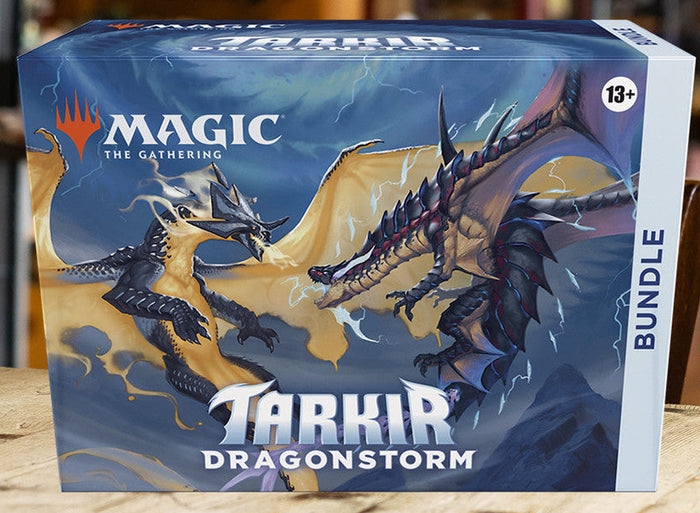 Blue rectangular bundle box with artwork of two dragons clashing in a lightning-filled, stormy sky.