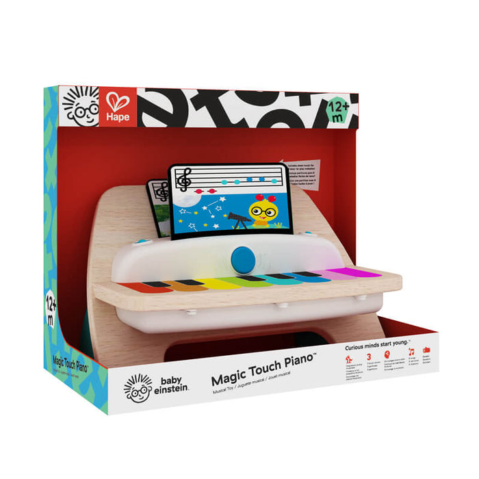Hape wooden toy piano in red packaging with vibrant rainbow keys, natural wood frame, and musical cards.