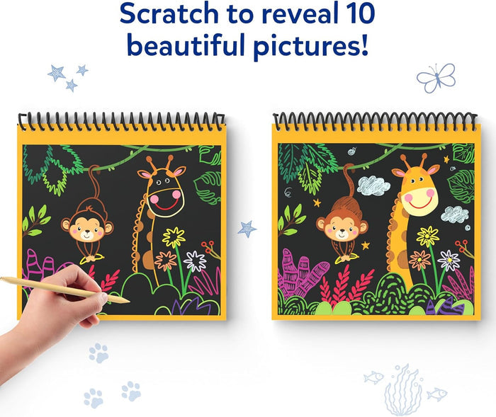 Hand using a stylus to reveal colorful animal drawings on a black scratch art pad next to a finished jungle scene.