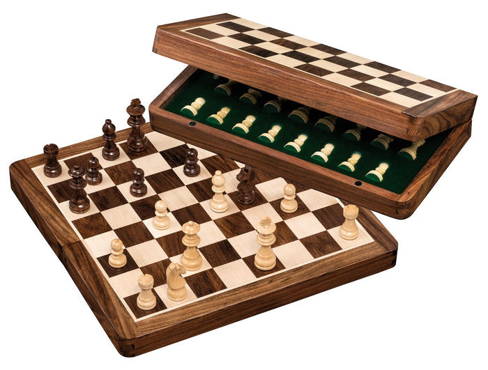 Magnetic wooden chess set with brown and cream pieces on a checkered board beside an open green-lined storage case.