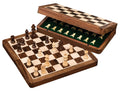 Magnetic wooden chess set with brown and cream pieces on a checkered board beside an open green-lined storage case.