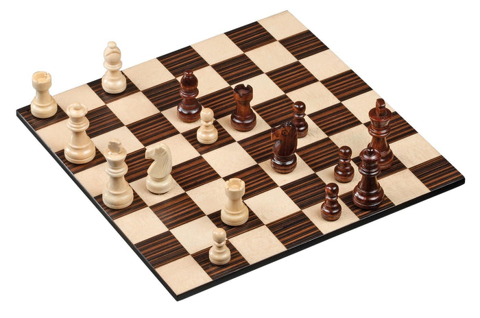Wooden chessboard with dark and light brown squares and carved chess pieces in cream and dark wood, shown from an angle.