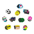 Twelve colorful magnetic slider toys featuring designs like a soccer ball, butterfly, alien, donut, and emojis.