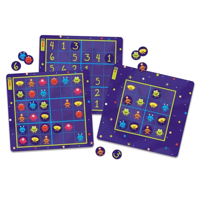 Purple space-themed magnetic boards featuring yellow grids with colorful monster characters and number tokens.