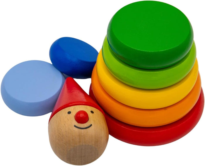 Colorful wooden stacking discs and a smiling figure head with a red pointed hat and nose.