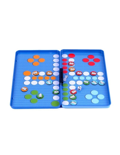 Open blue portable board game with colorful magnetic pieces and a white die on a white background.