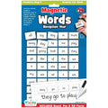 Blue board featuring a grid of white magnetic word tiles and a dry-erase pen for sentence writing practice.