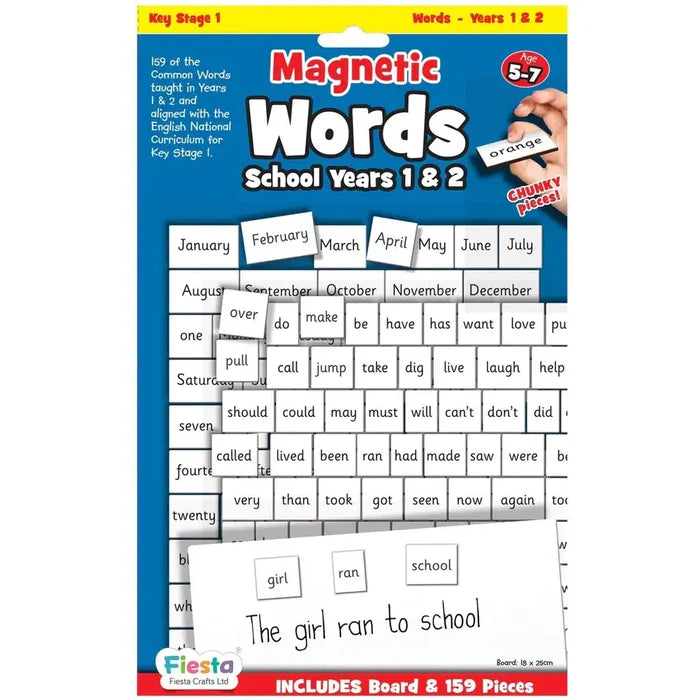 Educational set of 159 white magnetic word tiles on a blue board featuring months, verbs, and a sample sentence.