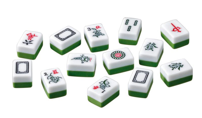 White and green Mah Jongg tiles with Chinese characters and symbols scattered on a white background.